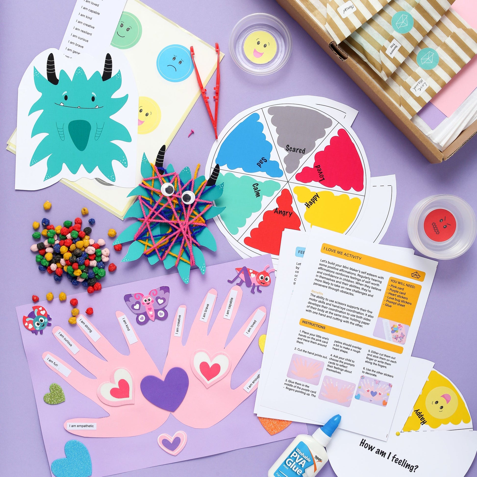 Children's craft materials and templates on a purple surface