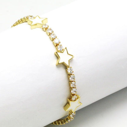 Gold bracelet with star-shaped charms on a white background