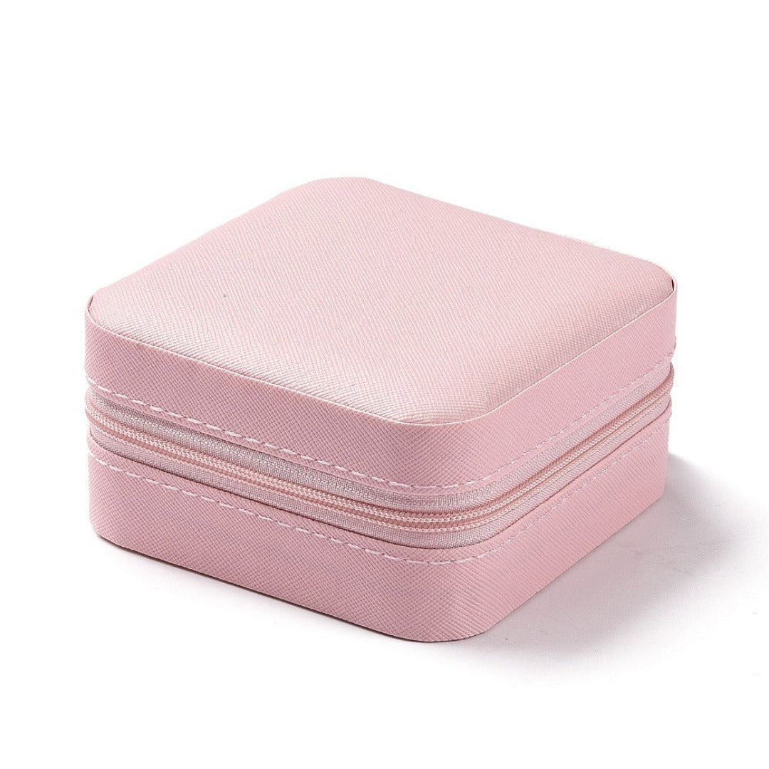 Pink jewelry box with a zipper on a white background