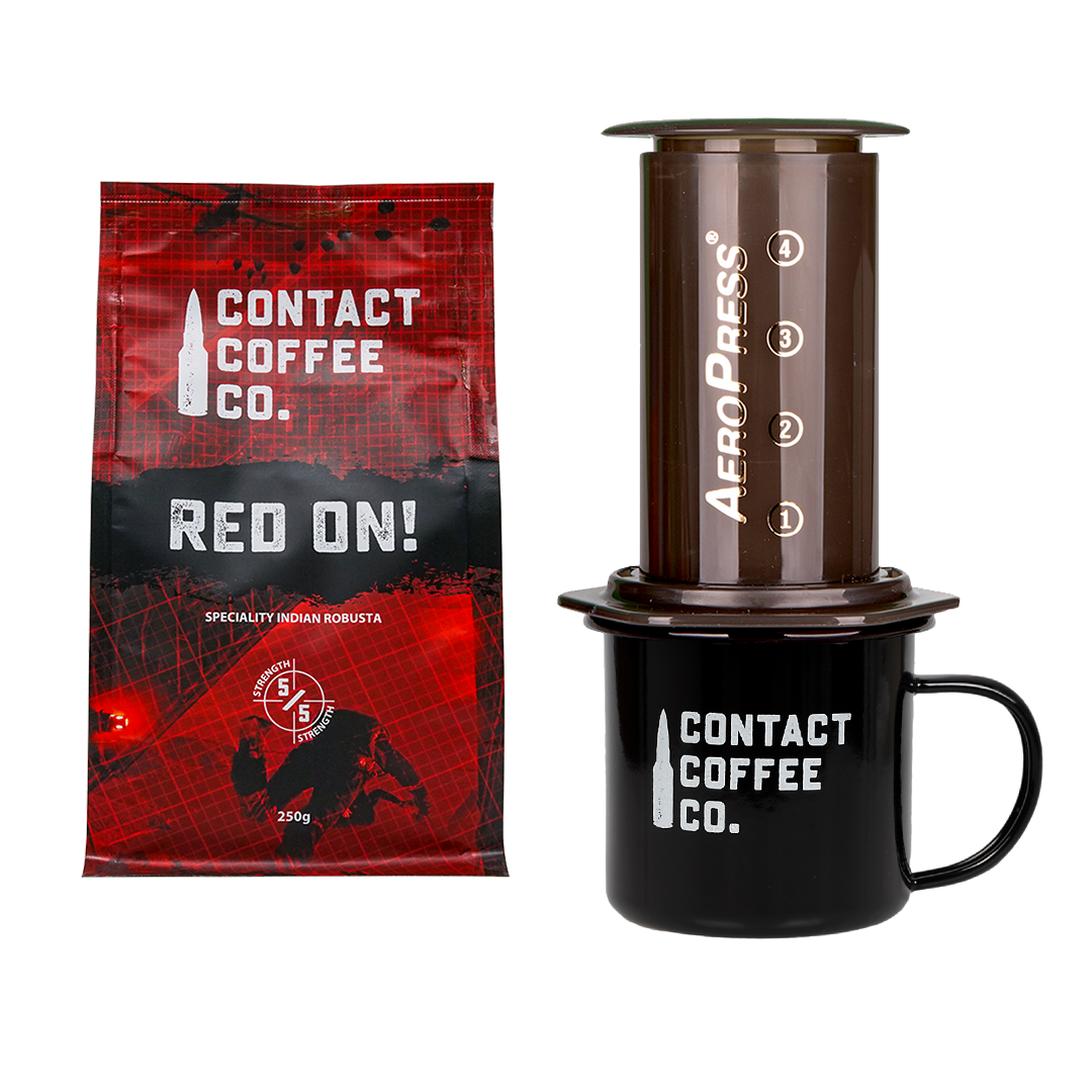 Contact Coffee Co. package, AeroPress coffee maker, and black mug on a white background