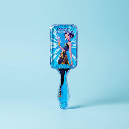 Blue hairbrush with a character design on a white background
