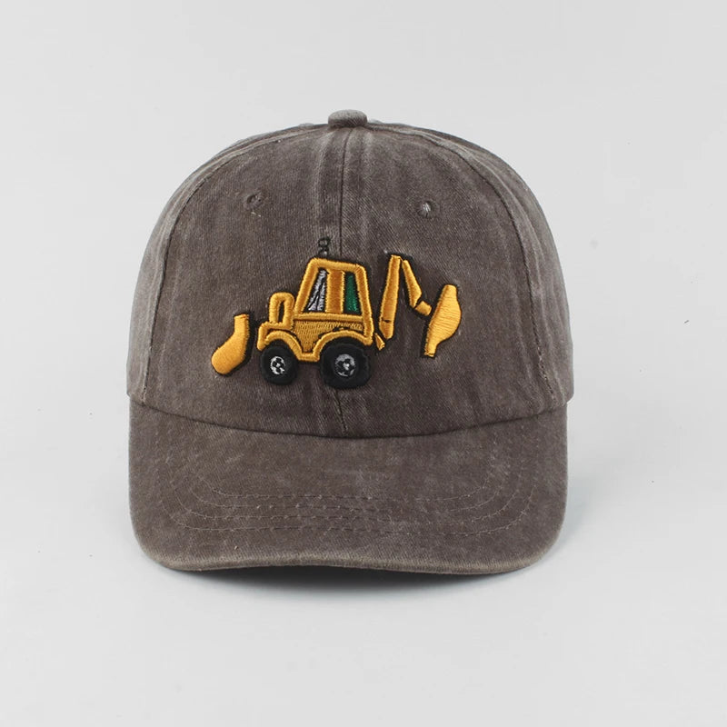 Brown cap with a yellow bulldozer emblem on a light gray background