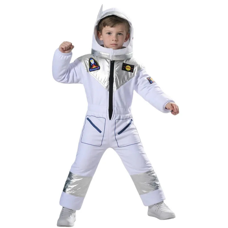 A young child modeling a white astronaut costume jumpsuit with shiny silver reflective panels on the chest, legs, and hood, set against a plain white background.