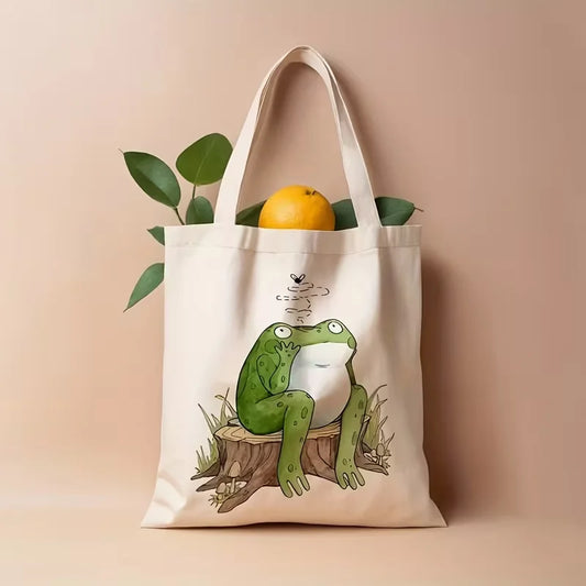 Tote bag with a frog design on a beige background