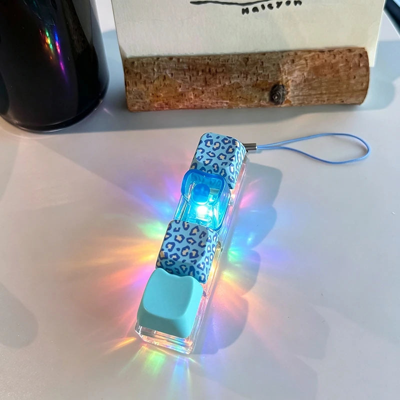 Small electronic device with blue LED light on a white surface