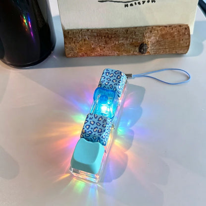 Small electronic device with blue LED light on a white surface
