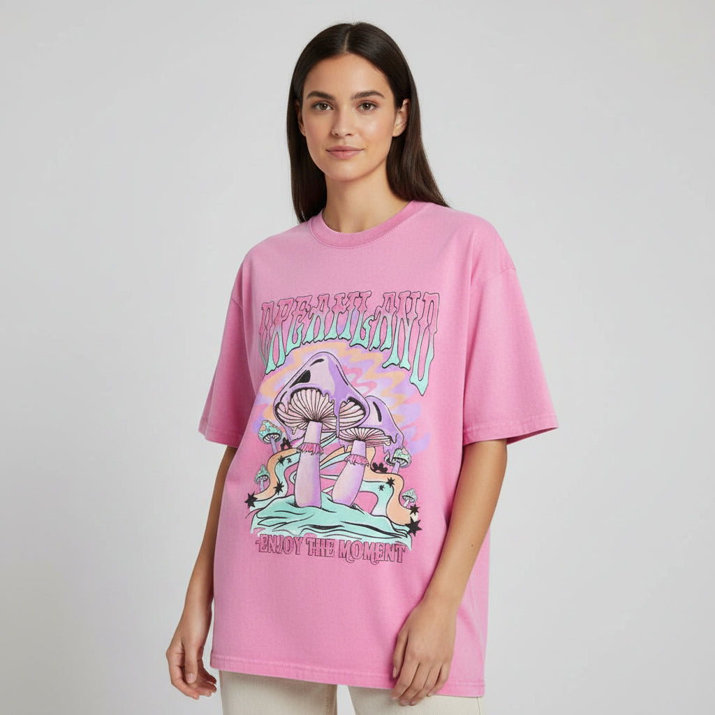 Pink t-shirt with mushroom graphic and text on a white background