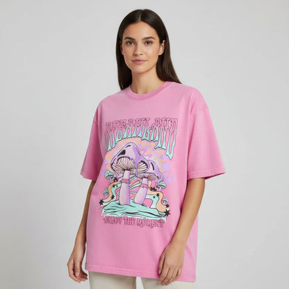 Pink t-shirt with mushroom graphic and text on a white background