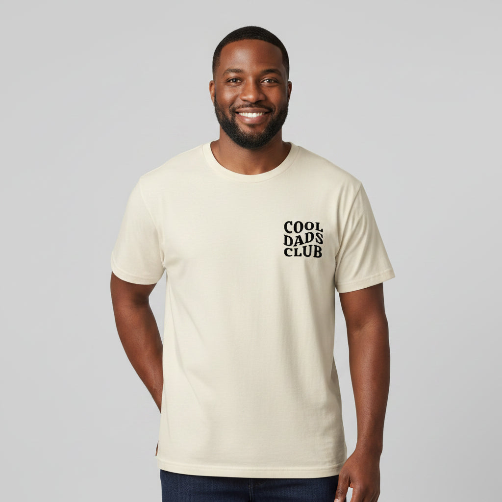 Man wearing beige cool dads club tshirt