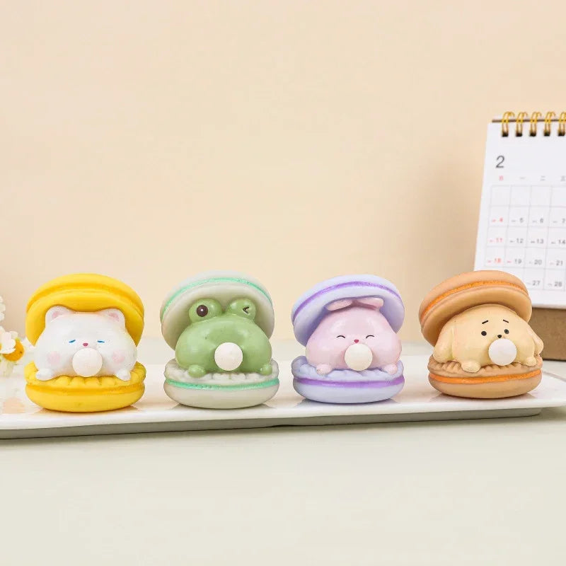 Four cute figurines with colorful hats on a light surface.