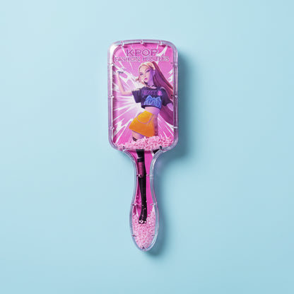 Pink hairbrush with character design on a white background