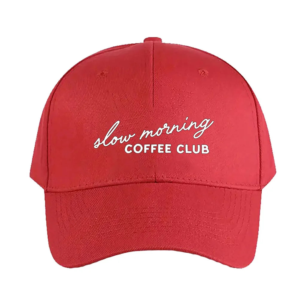 Red cap with 'slow morning COFFEE CLUB' text on a white background