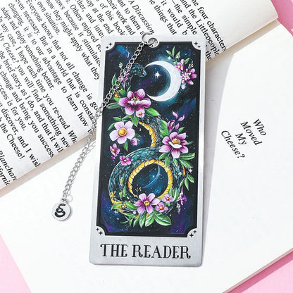 Decorative tarot card with dragon and flowers on a book page