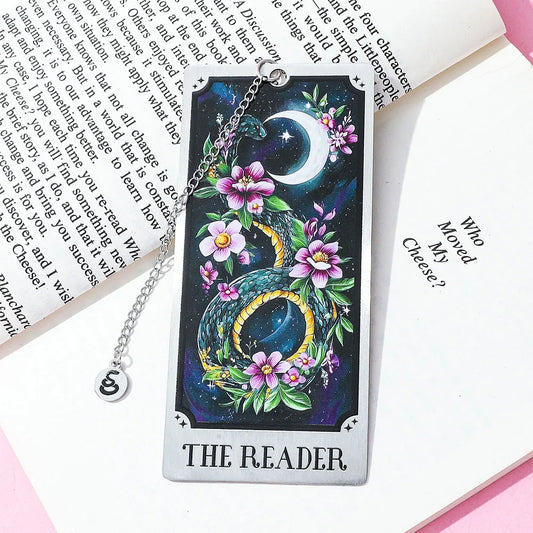 Decorative tarot card with dragon and flowers on a book page