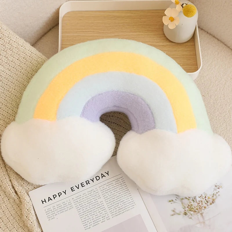 Rainbow-shaped pillow on a surface with a magazine underneath