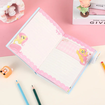 Notebook with pink decorative elements on a pink background