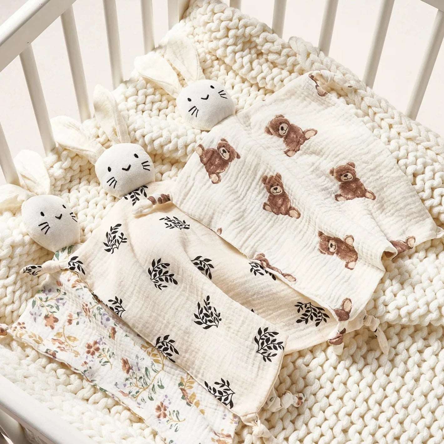 bunny muslin baby comforters in cot