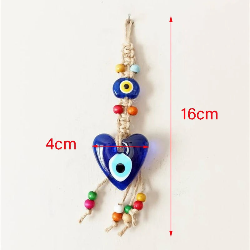 Decorative hanging charm with blue evil eye design and colorful beads, shown with measurements on a white background.