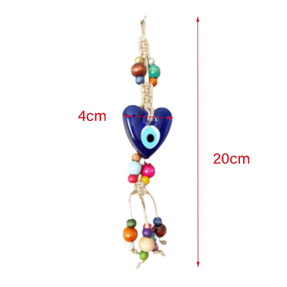 Colorful heart-shaped evil eye charm with beads and measurement details on a white background