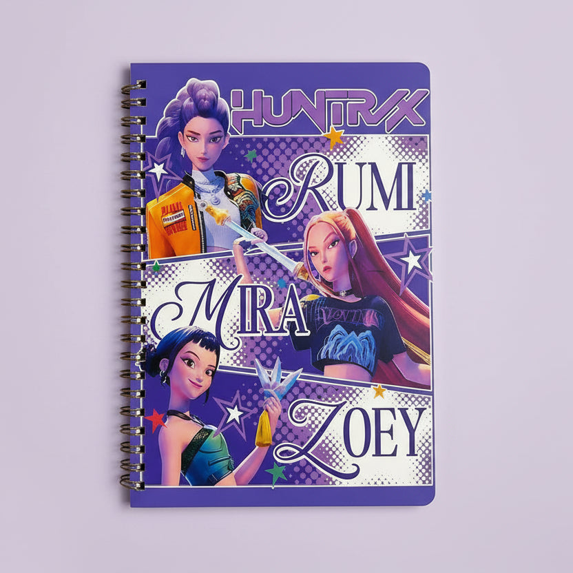 Notebook with 'Huntrix' characters Rumi, Mira, and Zoey on a purple background