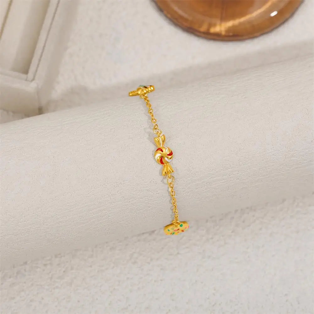 Gold bracelet with a decorative clasp on a white surface