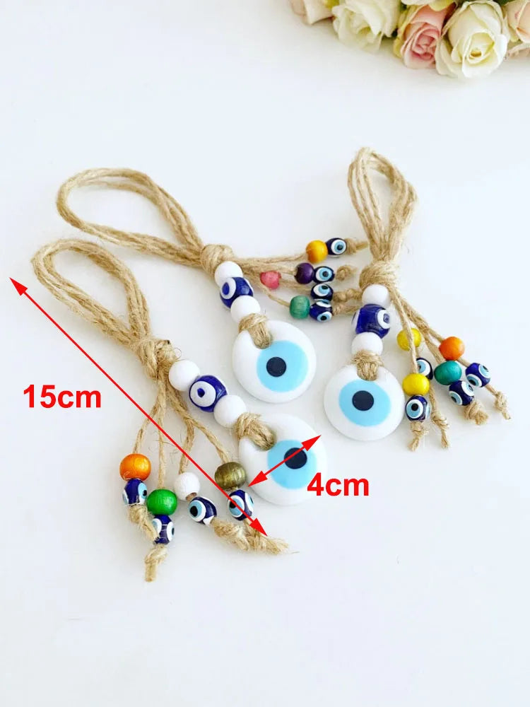 Decorative evil eye charms with colorful beads on a white background