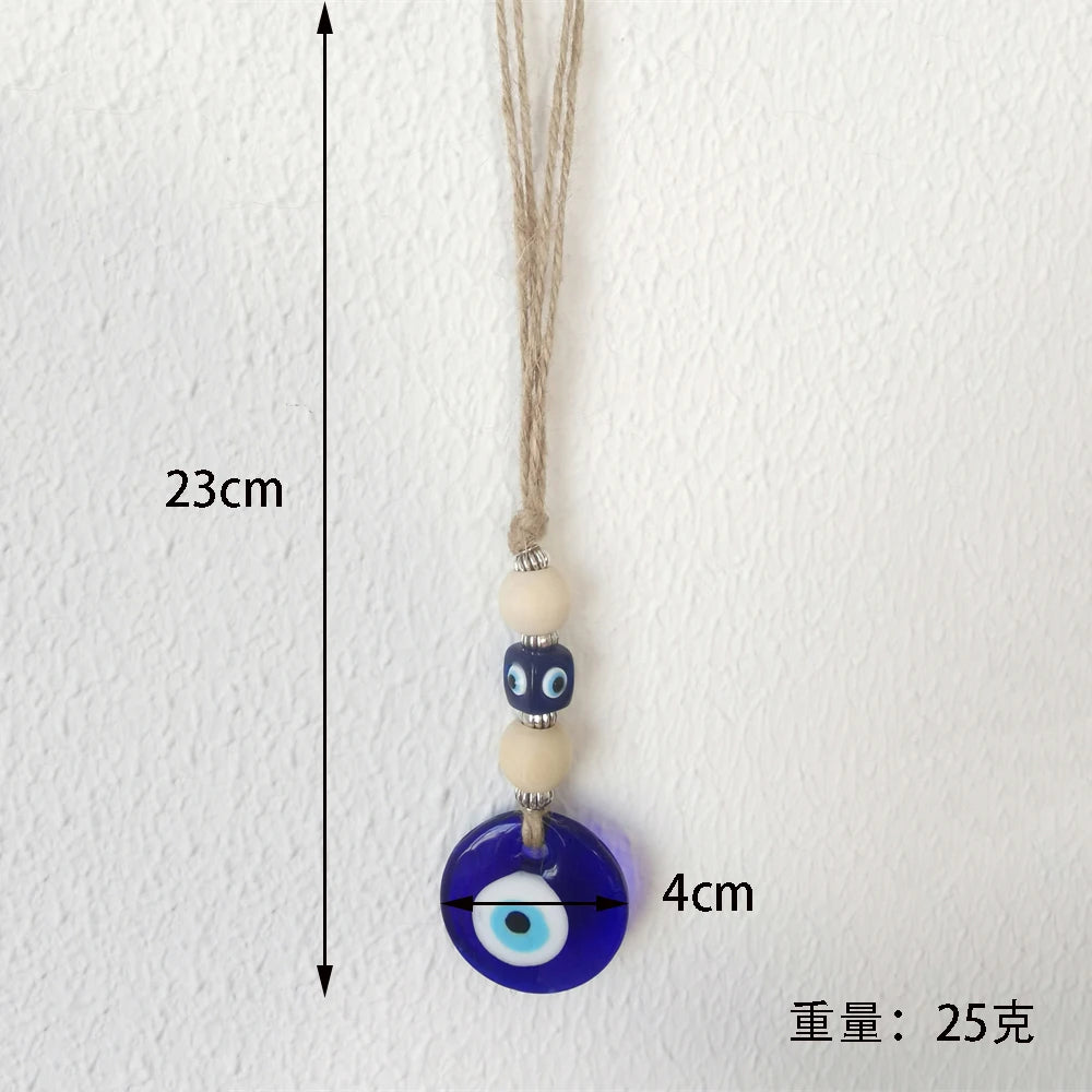 Evil eye pendant and measurement details on a white background