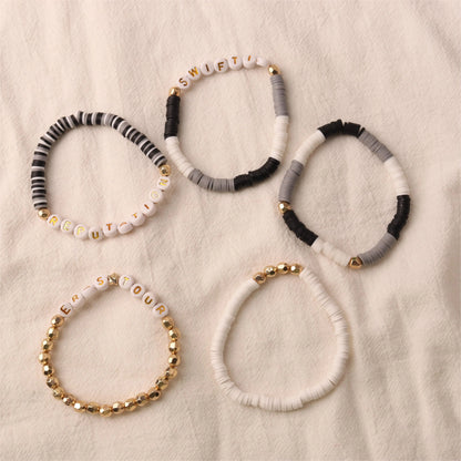 grey and gold bracelets