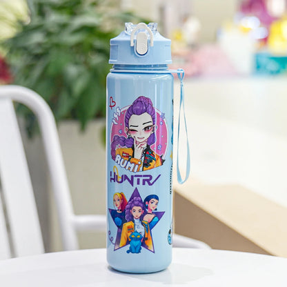 Children's water bottle with cartoon characters on a table
