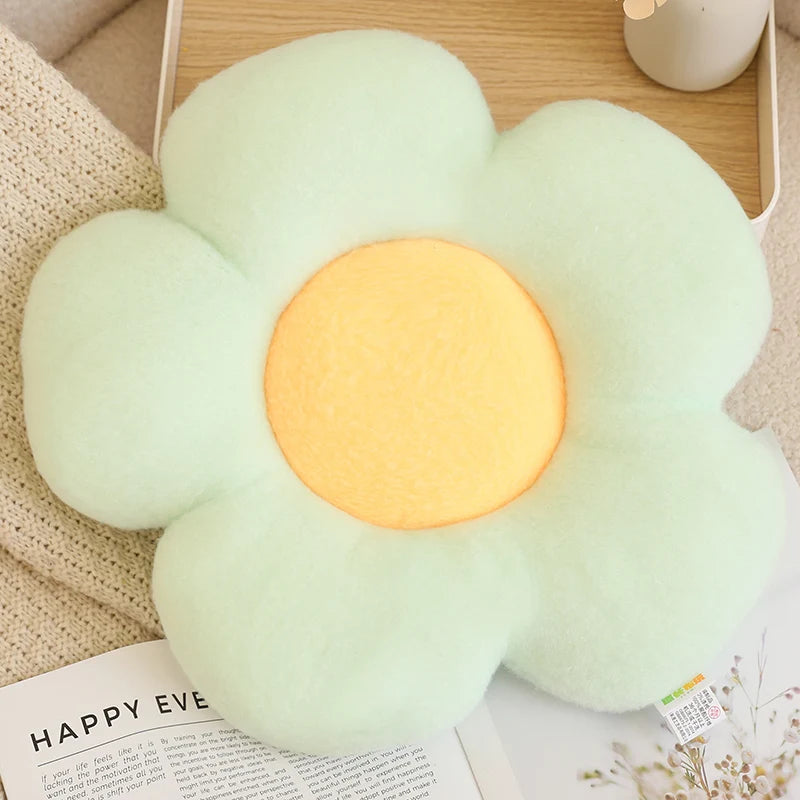 Flower-shaped light with a glowing center on a surface with a magazine underneath.
