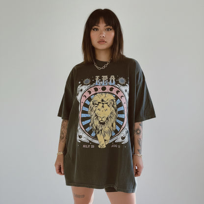 Person wearing a dark grey t-shirt with a lion graphic and text, standing against a light gray background.