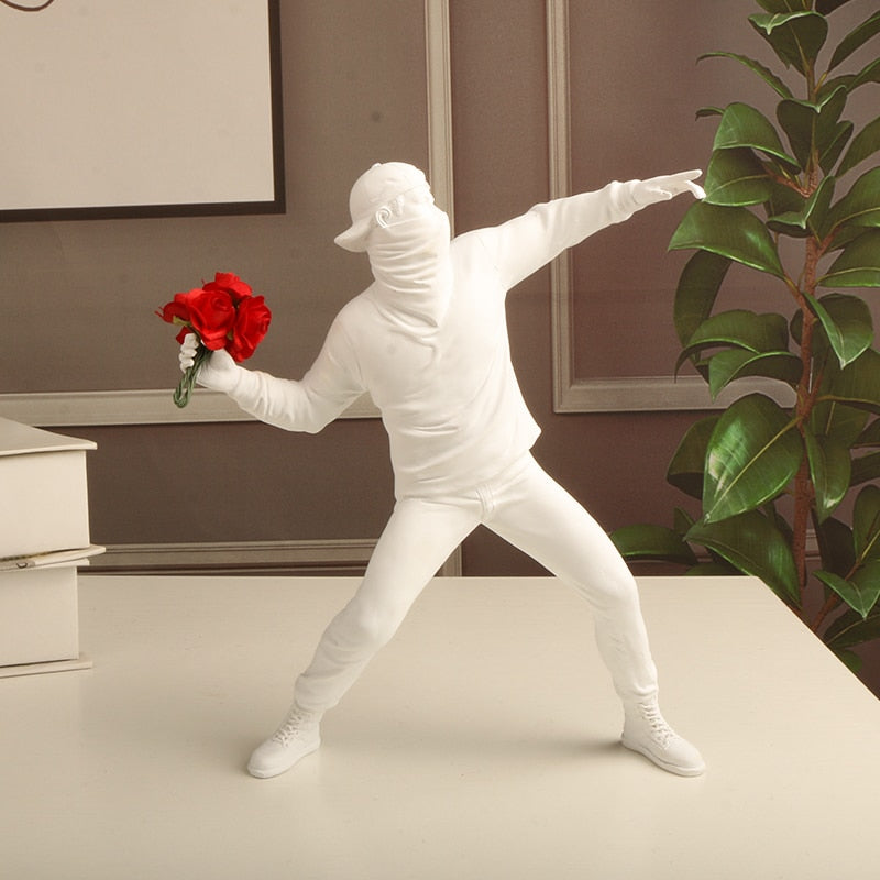 white Banksy flower thrower statue
