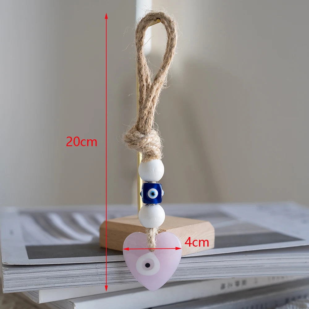 Heart-shaped charm with measurement details on a neutral background