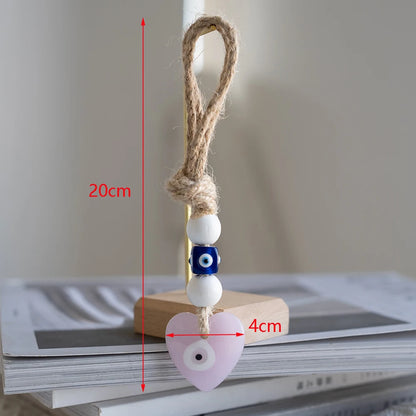 Heart-shaped charm with measurement details on a neutral background