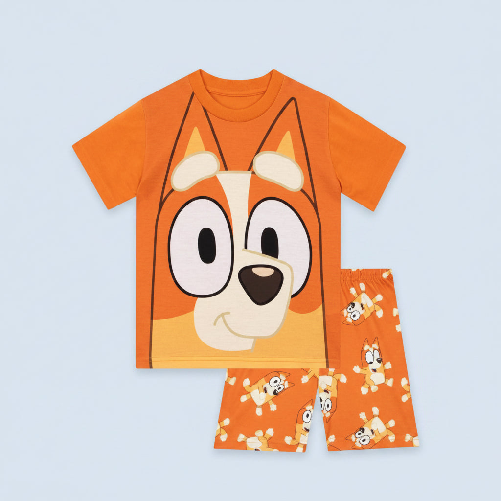 Children's orange pajama set with cartoon dog face design on a white background