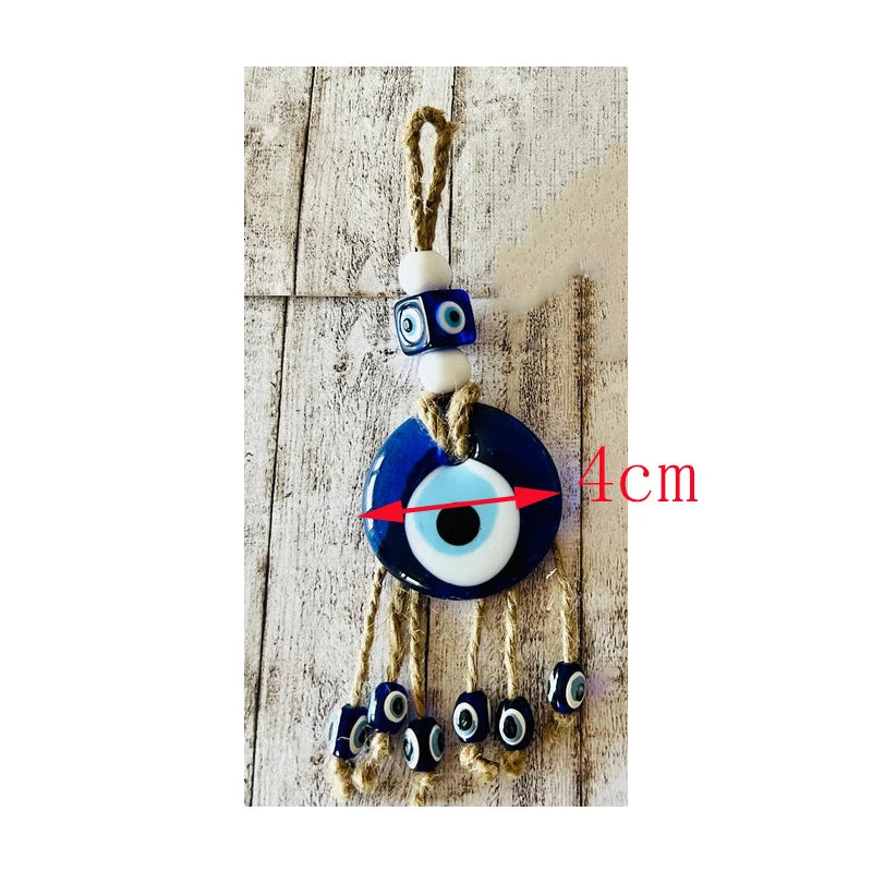 Evil eye charm with beads on a wooden background
