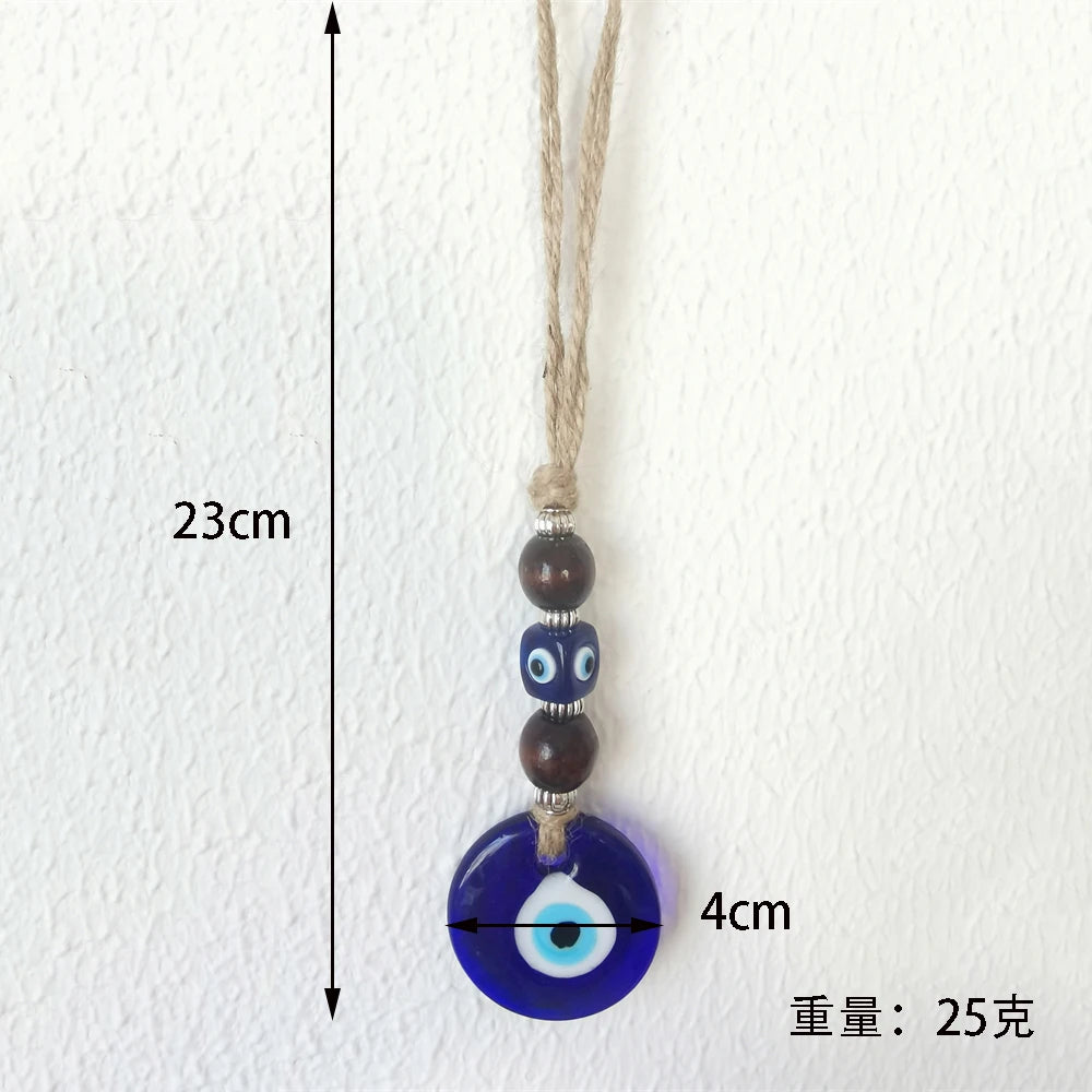 Necklace with a blue evil eye pendant on a white background, showing measurements.