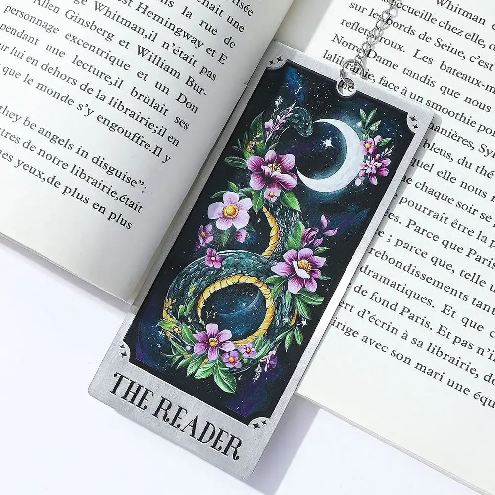 Decorative bookmark with dragon and floral design on an open book