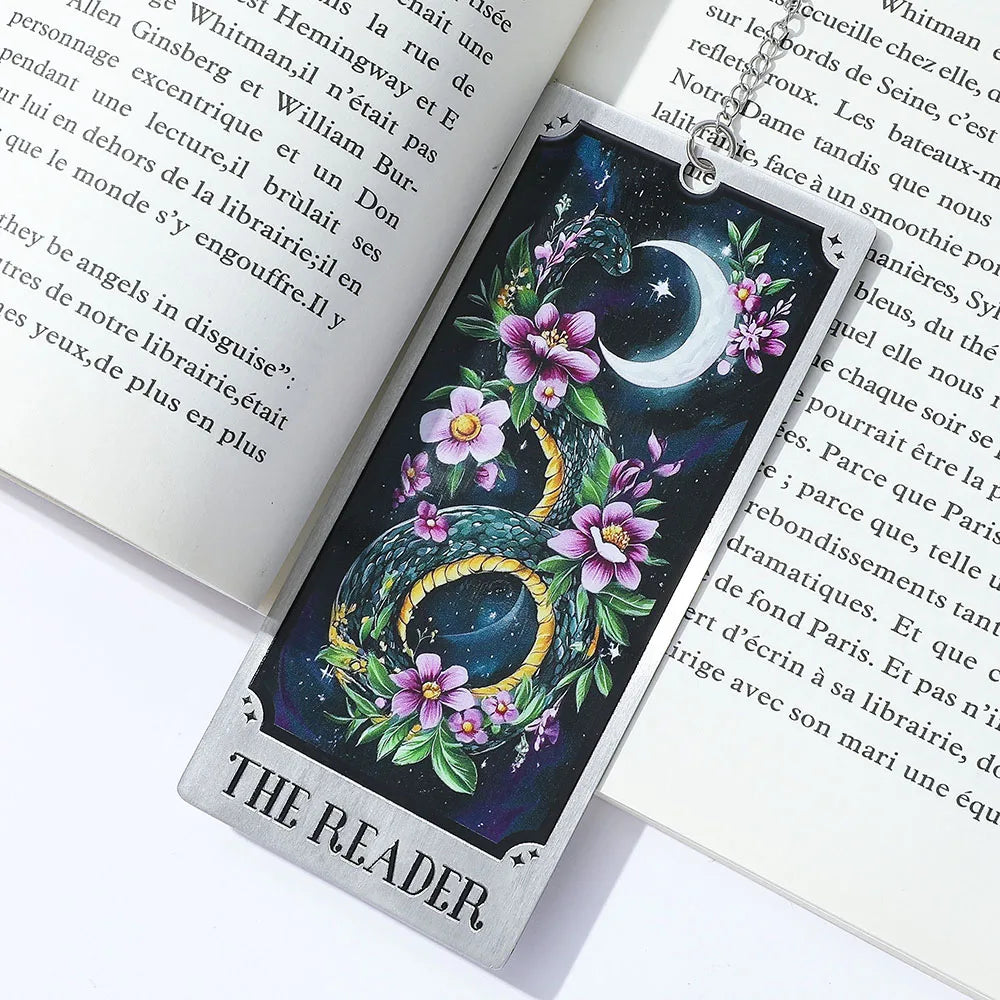 Decorative bookmark with dragon and floral design on an open book