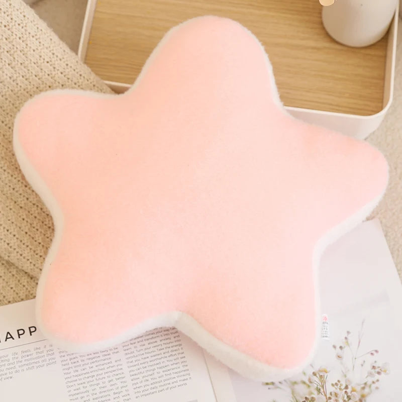 Pink butterfly-shaped cushion on a surface with a blurred background
