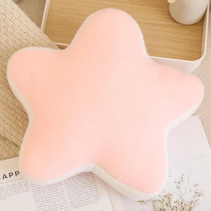 Pink butterfly-shaped cushion on a surface with a blurred background
