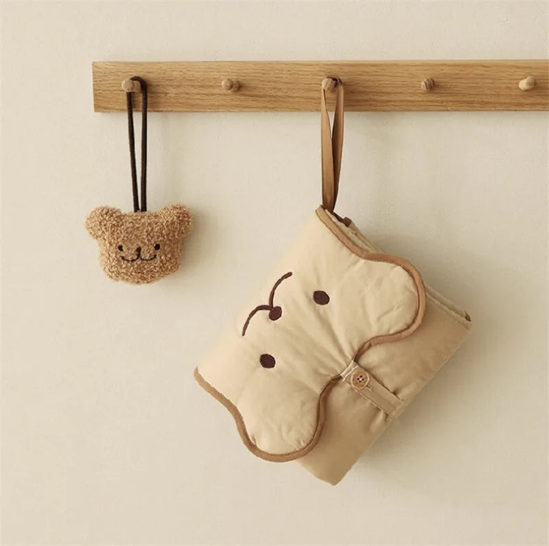 baby changing mat hanging on hook