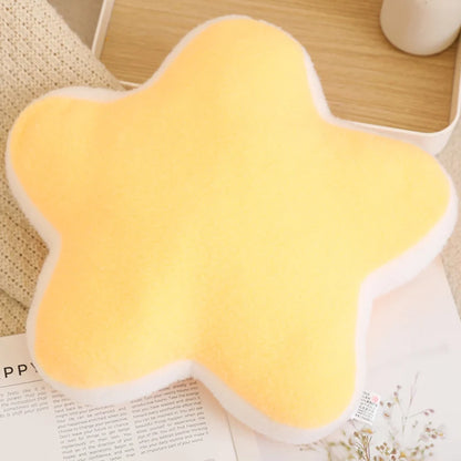 Yellow star-shaped cushion on a surface with a blurred background