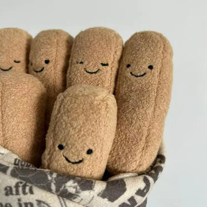 Five plush toy fingers with smiling faces peeking out from a newspaper.