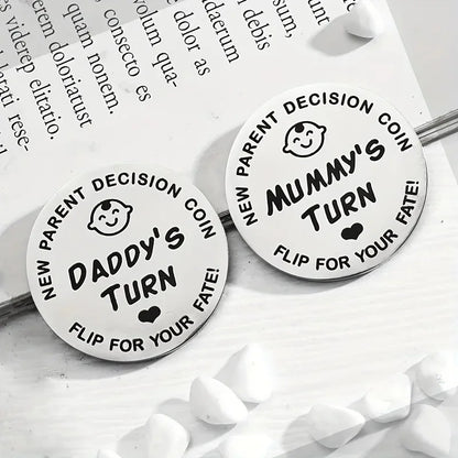 Two round decision coins labeled 'Daddy's Turn' and 'Mummy's Turn' on a white surface with text in the background.