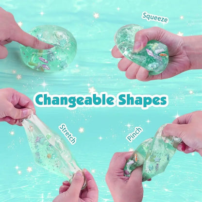 Hands interacting with a squishy green toy on a light blue background