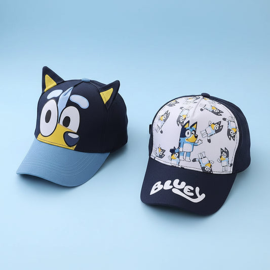 Two children's baseball caps with cartoon design on a white surface.