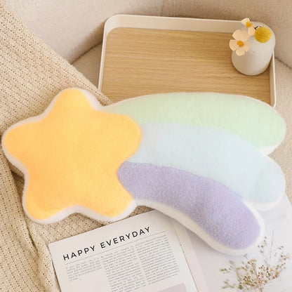 Star-shaped pillow with a gradient of yellow to white on a table with a magazine underneath.