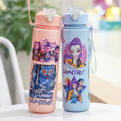 Two colorful water bottles with cartoon designs on a table.