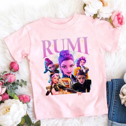 Pink t-shirt with character design and 'RUMI' text on a floral background